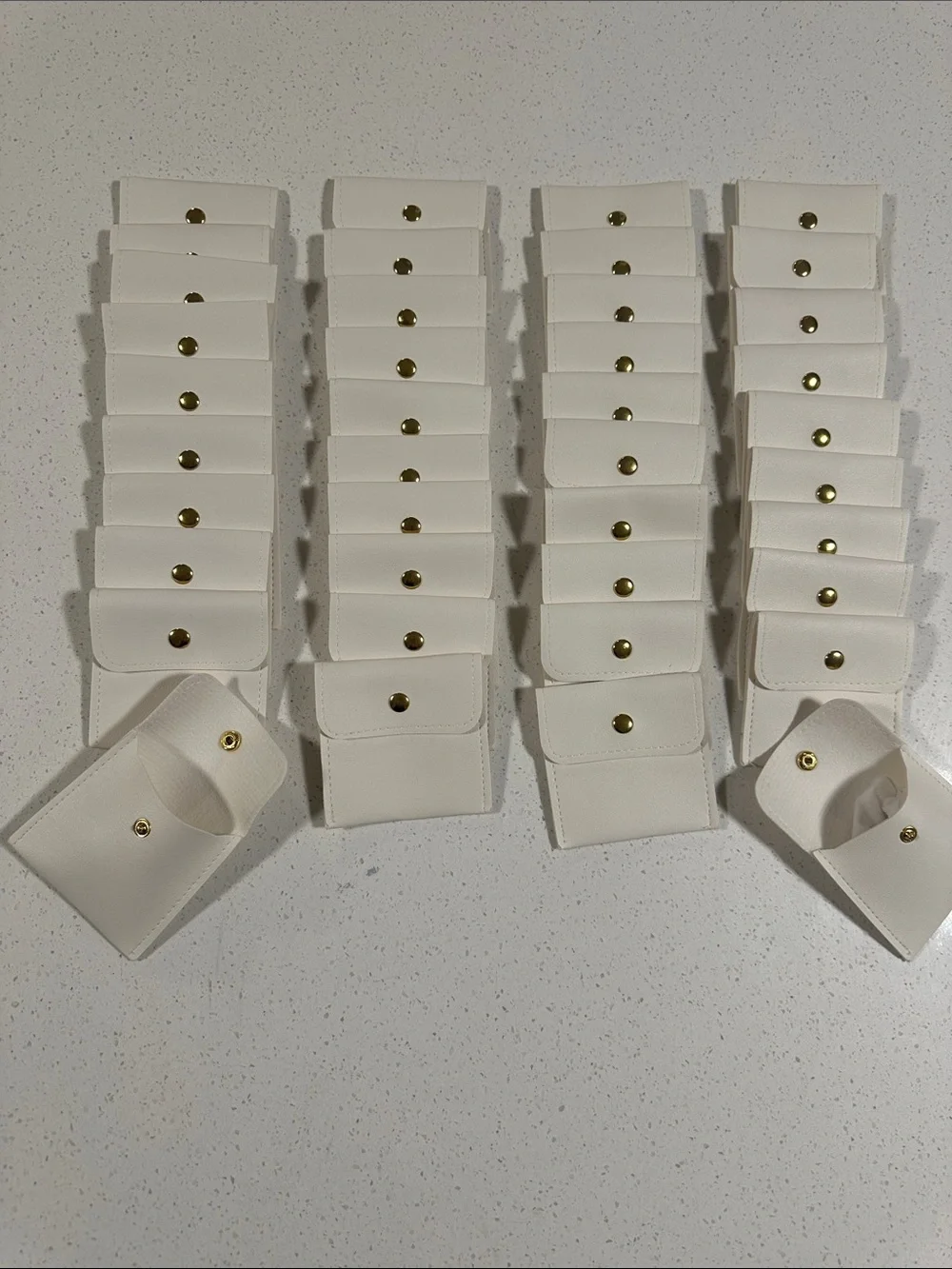 Collection of 40 Ivory Faux Leather Mini Jewelry, Coins, Hair Clips Storage Bags